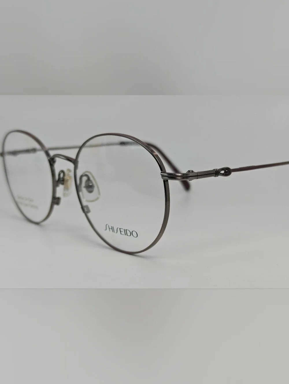 Shiseido 705.  Women's  Round Metal Glasses in Purple Gunmetal. Systech.